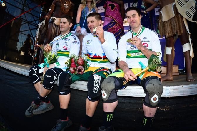 World Champion Greg Minnaar is flanked by two Australians silver medalist Michael Hannah (left) and Jared Graves (right) after the men's downhill final