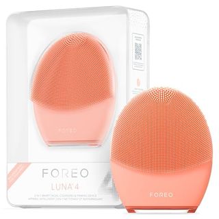 Foreo Luna 4 Face Cleansing Brush beside its box on a white background