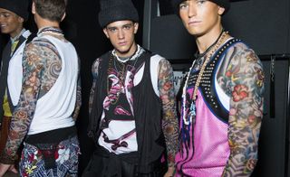 Dsquared2 models wearing tattoo effect tops