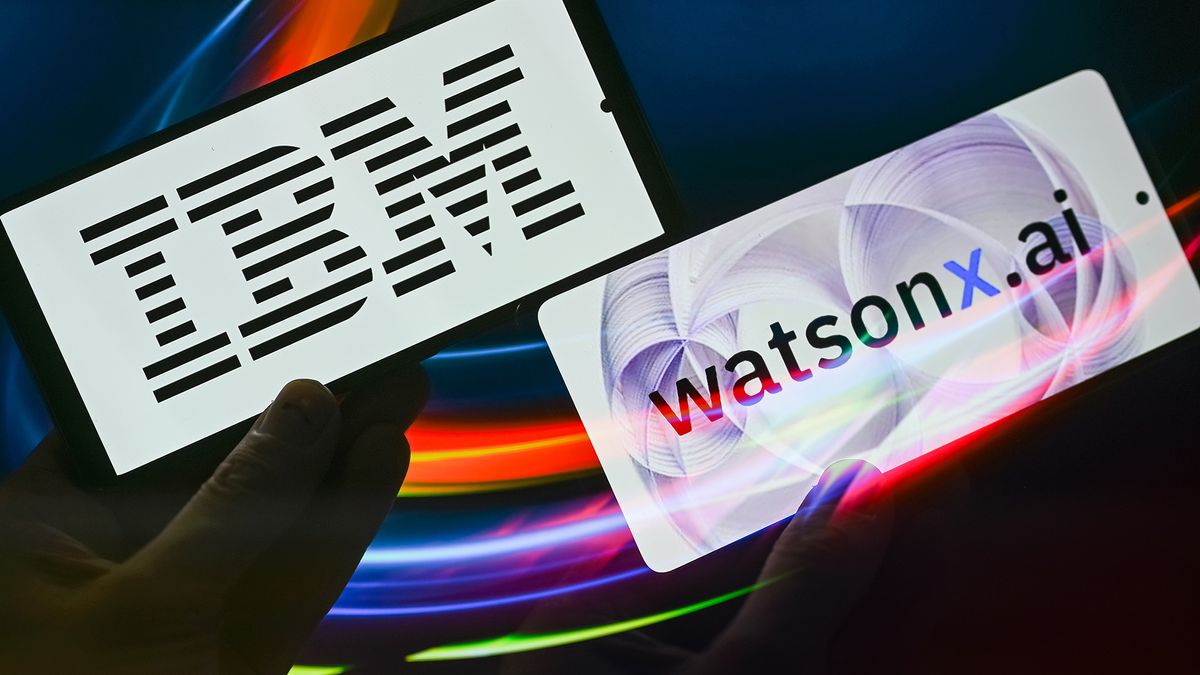 Two small screens, one with the IBM logo and one with the watsonx logo being held by hands in silhouette with a background of colourful, luminous streaks denoting connectivity.