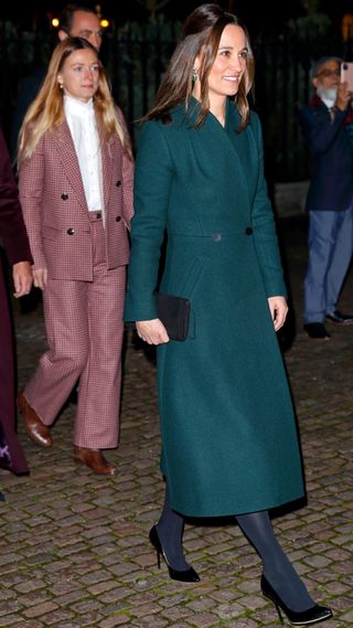 Pippa Middleton walks as she arrives to attend the 'Together at Christmas' community carol service in 2021