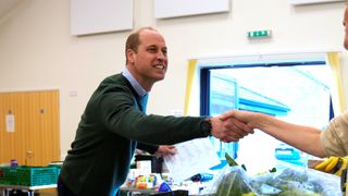 a photo of Prince William wearing a Garmin Forerunner 245