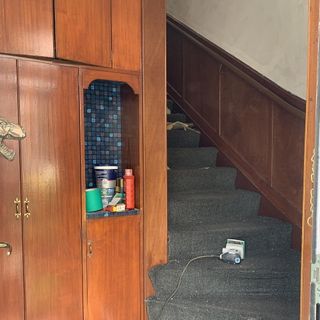 hallway with stairway and cupboard