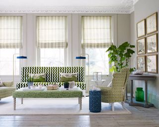A light living room with green accents