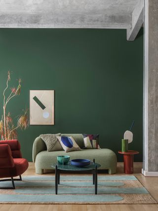 Dark green painted wall in living room