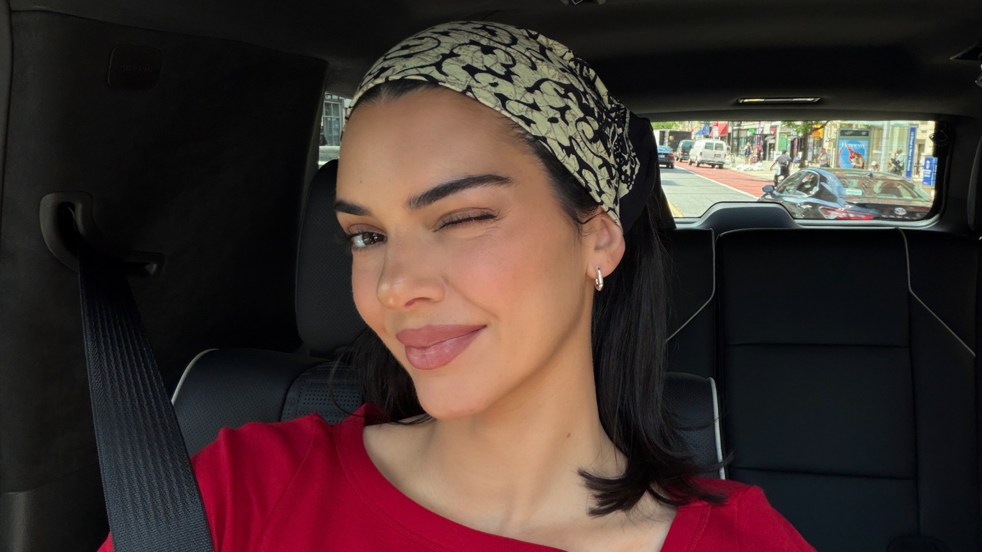 Photo of Kendall Jenner winking in a car selfie