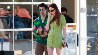 Sophie Turner in knit green dress