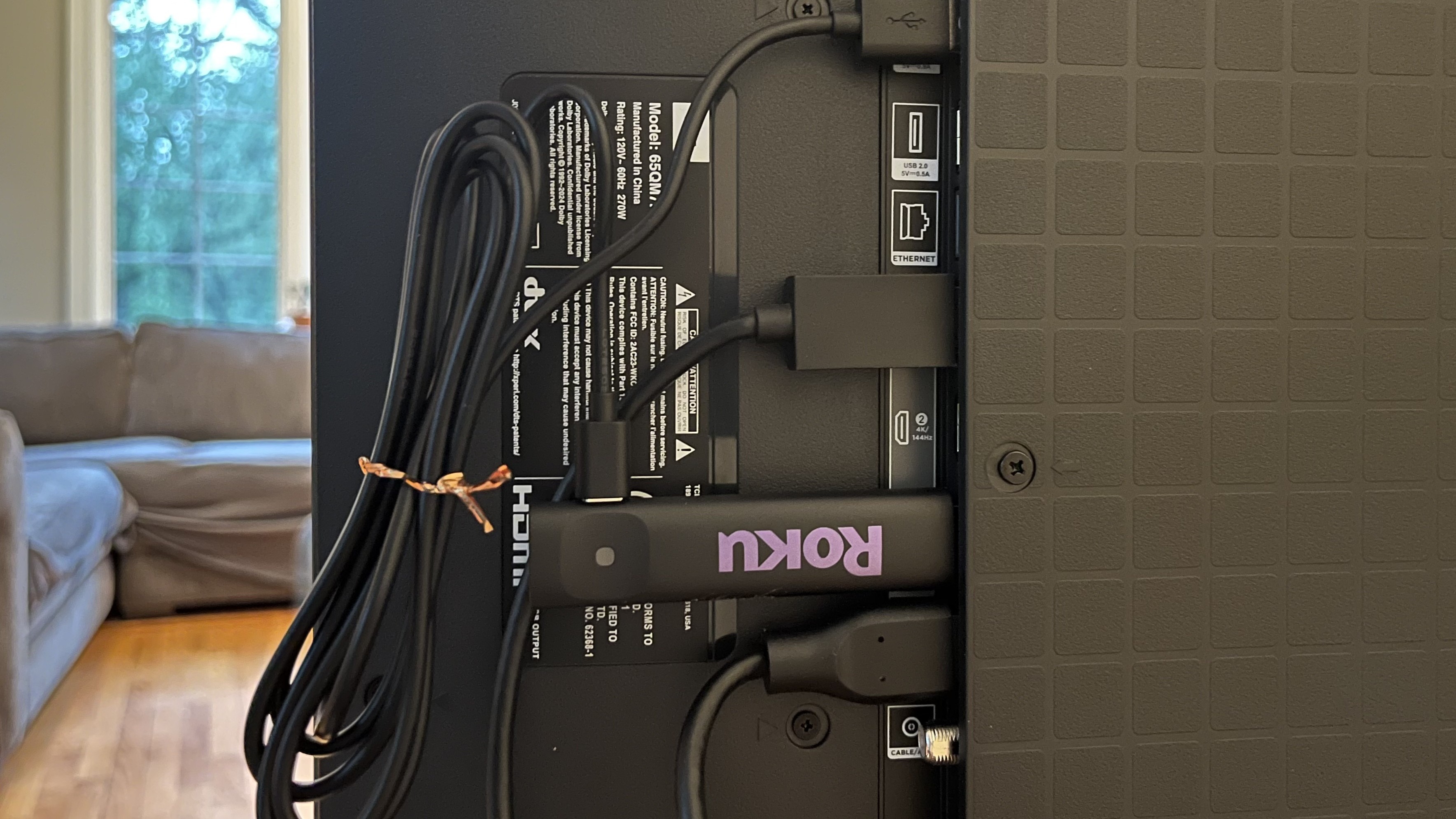 Roku Streaming Stick plugged into TV's HDMI port