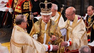 Britain's King Charles III with the St Edward's Crown on his head attends the Coronation Ceremony inside Westminster Abbey in central London on May 6, 2023. The set-piece coronation is the first in Britain in 70 years, and only the second in history to be televised. Charles will be the 40th reigning monarch to be crowned at the central London church since King William I in 1066. Outside the UK, he is also king of 14 other Commonwealth countries, including Australia, Canada and New Zealand. Camilla, his second wife, will be crowned queen alongside him and be known as Queen Camilla after the ceremony. (Photo by Yui Mok / POOL / AFP)