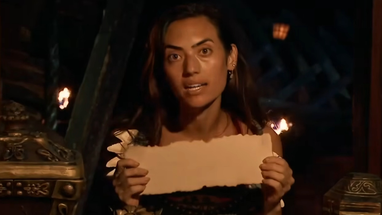 Savannah holds a blank voting parchment as she talks about not using her advantage on Survivor.