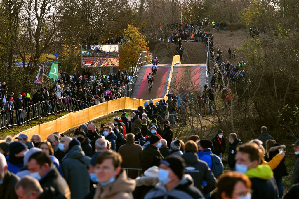 KOKSIJDE BELGIUM NOVEMBER 21 A general view of Laura Verdonschot of Belgium and Team Pauwels Sauzen Bingoal Helene Clauzel of France and AS Bike Crossteam and Millie Couzens of United Kingdom compete while fans cheer during the 50th Koksijde UCI CycloCross Worldcup 2021 Womens Elite CXWorldCup on November 21 2021 in Koksijde Belgium Photo by Luc ClaessenGetty Images