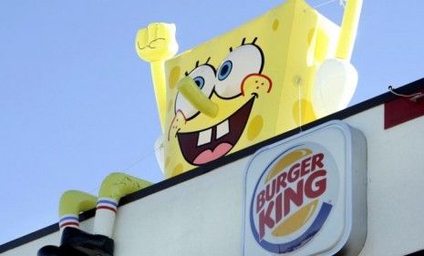 SpongeBob SquarePants sits on top of a Burger King restaurant: The fast food chain is one of 19 adding healthier options to their kids&amp;#039; meal menus.