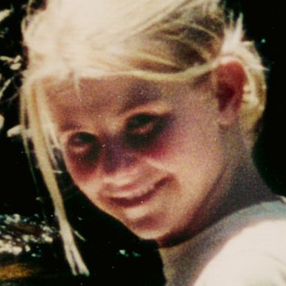 an old photo of elizabeth smart smiling at the camera as a still featured in the netflix true crime documentary kidnapped