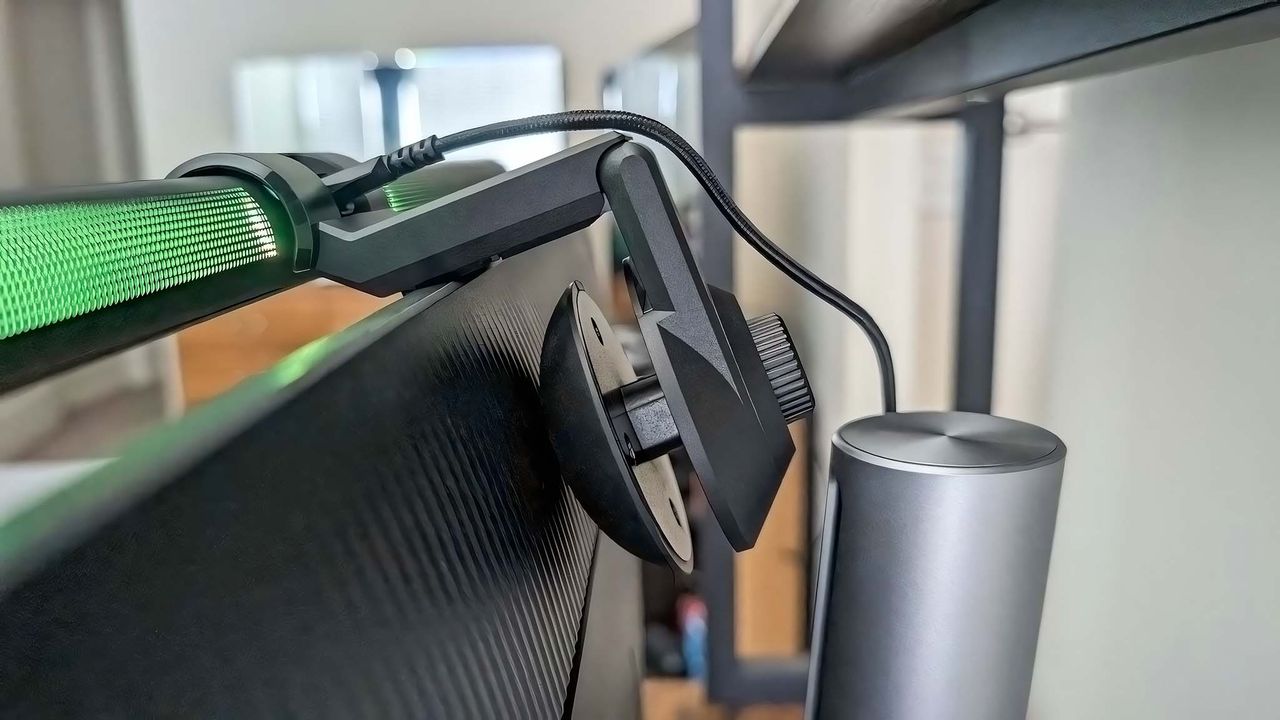 A closeup of the ASUS ROG Aura Monitor Light Bar's backside while on top of a monitor.
