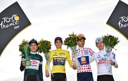 The 2023 Tour de France podium with Jonas Vingegaard (in yellow), Jasper Philipsen (in green), Giulio Ciccone (in the polka dots), and Tadej Pogačar (in white)