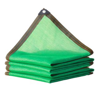 Green garden shade cloth with a black edge folded up on a white background