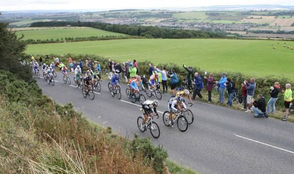 Fans line the road as the Tour of Britain peloton ride pass