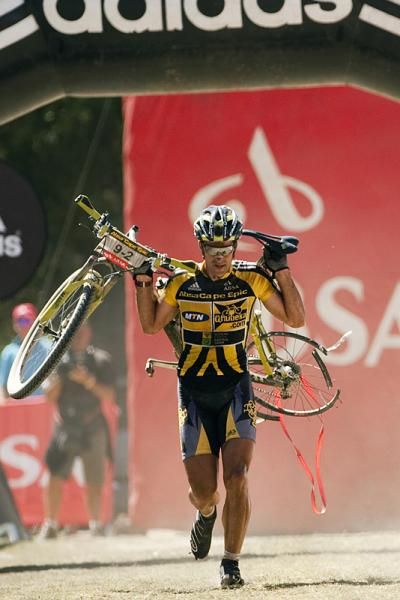 Alban Lakata runs his bike home