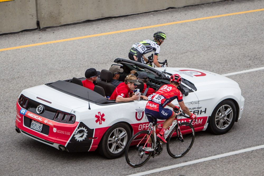 Riders stop at the medical car after today's crash.
