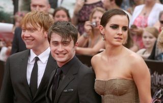 (L to R) Rupert Grint, Daniel Radcliffe and Emma Watson attend the premiere of "Harry Potter and the Deathly Hallows - Part 2" at Avery Fisher Hall, Lincoln Center on July 11, 2011 in New York City.