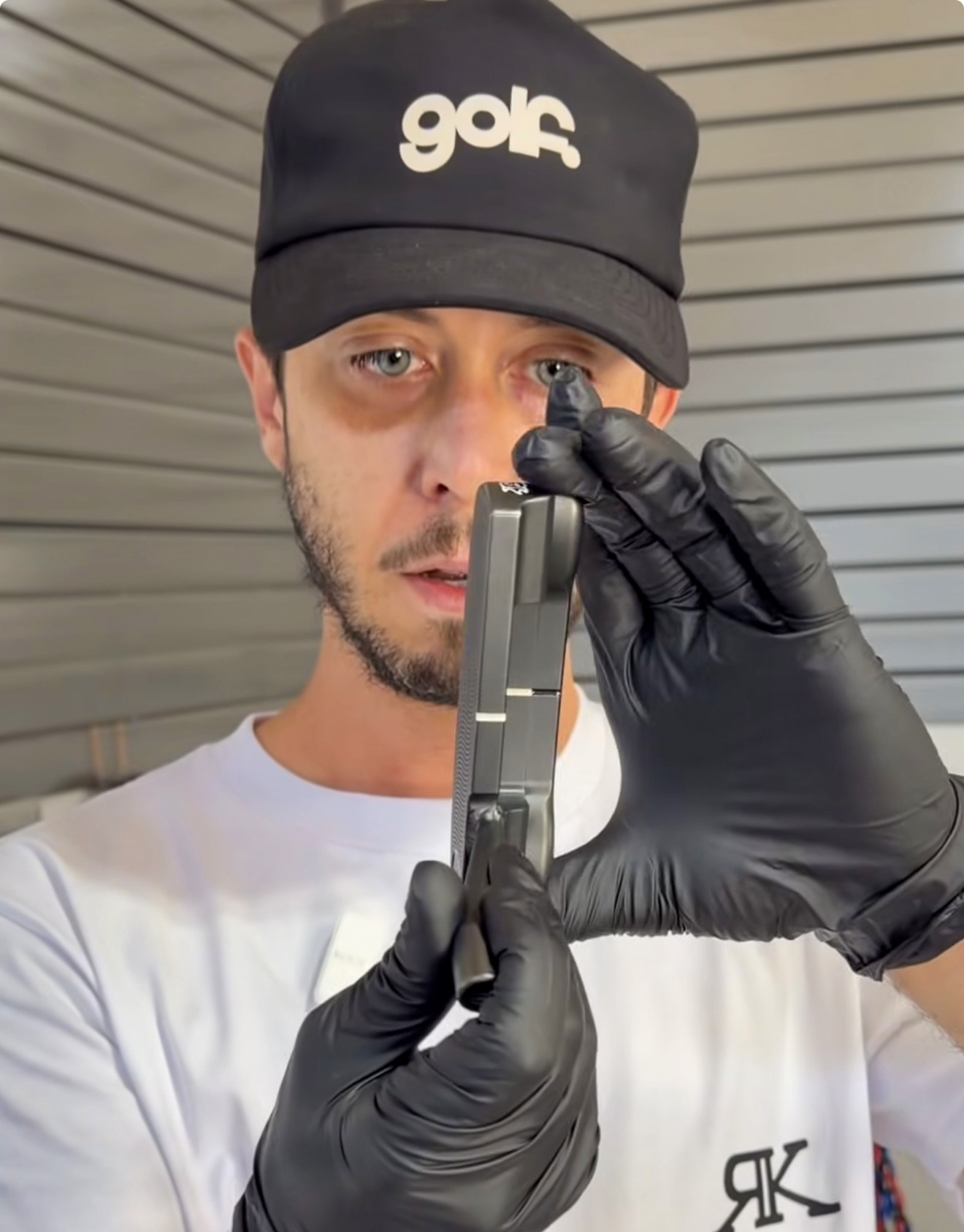 Photo of Rush Kane looking at a putter