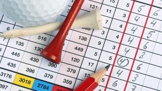 Golf scorecard detail with golf ball, tees and pencil GettyImages-96451938