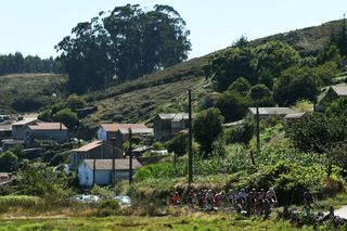 MOS SPAIN SEPTEMBER 04 A general view of Lilian Calmejane of France Clment Champoussin of France Stan Dewulf of Belgium and AG2R Citren Team Floris De Tier of Belgium and Team AlpecinFenix Daniel Navarro Garcia of Spain and Team Burgos BH Jess Herrada Lopez of Spain and Team Cofidis Mikel Bizkarra Etxegibel of Spain and Team Euskaltel Euskadi Jan Hirt of Czech Republic and Team Intermarch Wanty Gobert Matriaux Sylvain Moniquet of Belgium and Team Lotto Soudal Nicholas Schultz of Australia and Team BikeExchange Chris Hamilton of Australia and Team DSM Romain Bardet of France and Team DSM Michael Storer of Australia and Team DSM polka dot mountain jersey Matteo Trentin of Italy and UAE Team Emirates Ryan Gibbons of South Africa and UAE Team Emirates compete in the breakaway passing through Loureza village during the 76th Tour of Spain 2021 Stage 20 a 2022km km stage from Sanxenxo to Mos Alto Castro de Herville 502m lavuelta LaVuelta21 on September 04 2021 in Mos Spain Photo by Tim de WaeleGetty Images