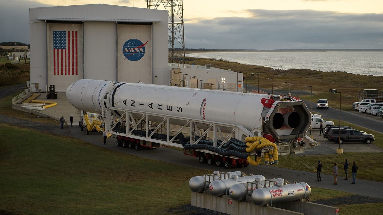 A Northrop Grumman Antares rocket is seen as it is rolled out of the Horizontal Integration Facility to launch Pad-0A, Tuesday, Oct. 29, 2019, at NASA's Wallops Flight Facility in Virginia.