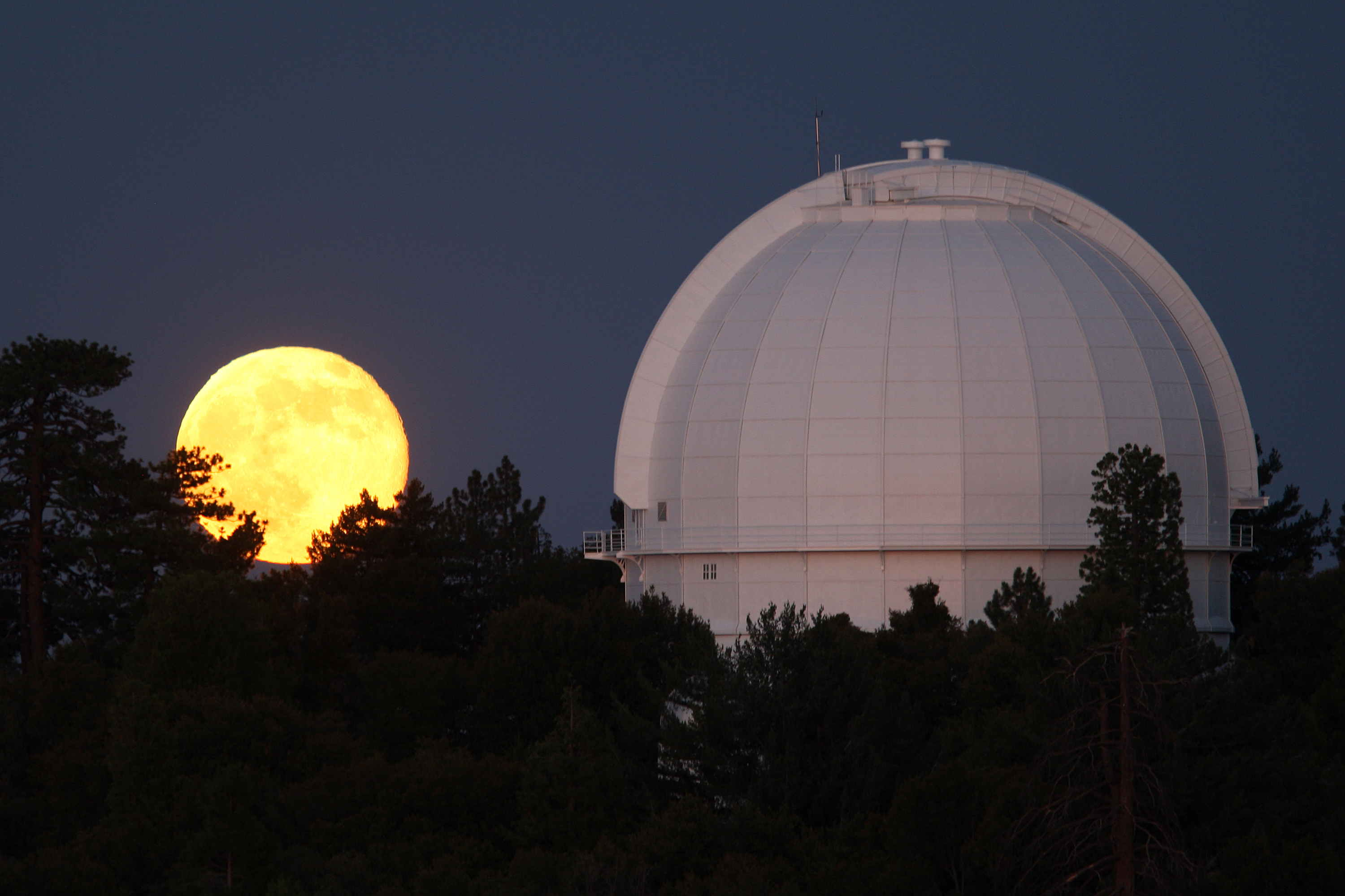 A supermoon rises behind the Mount Wilson Observatory on July 12, 2014, northeast of Los Angeles, California.