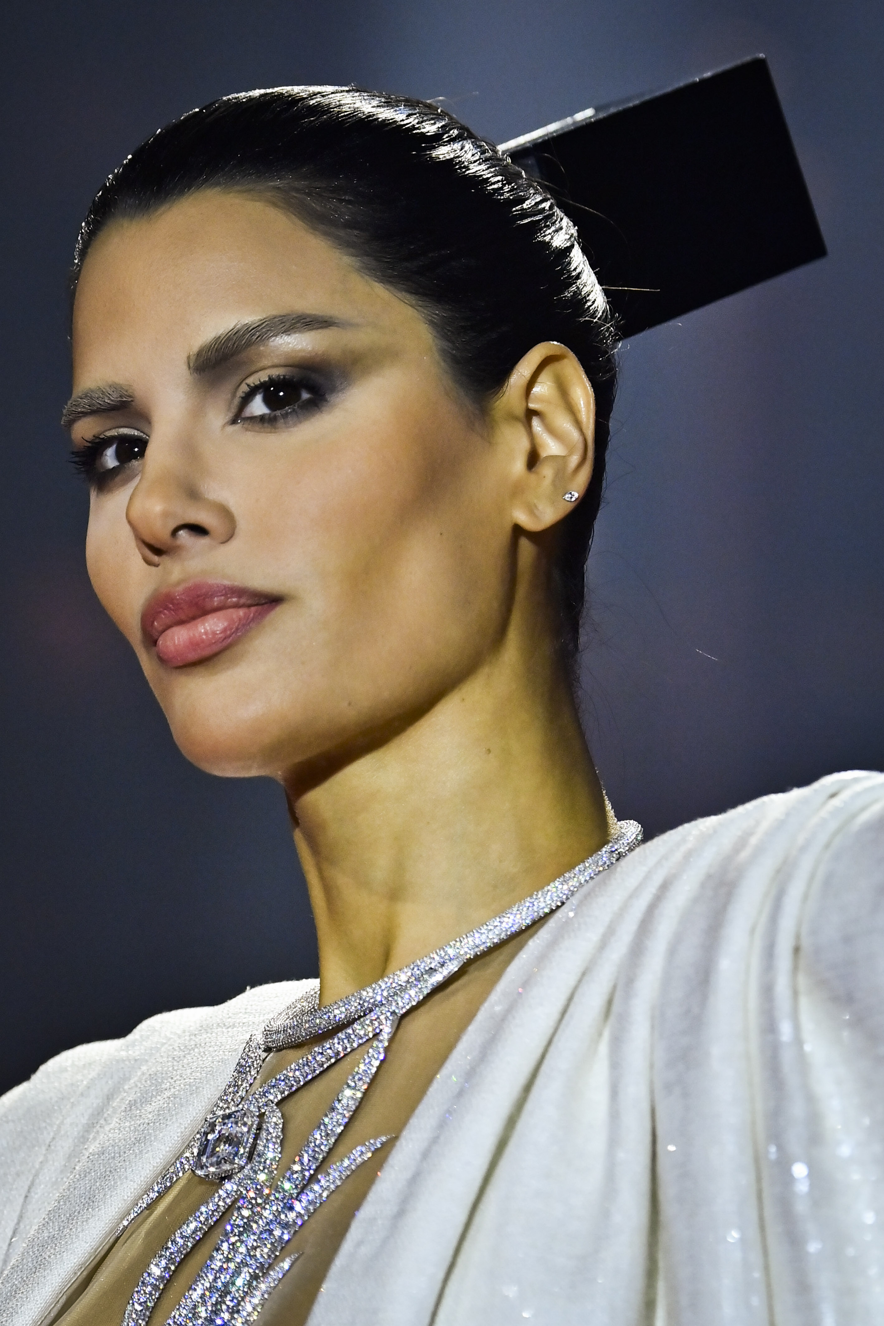 a model wearing smokey eye makeup during a runway show