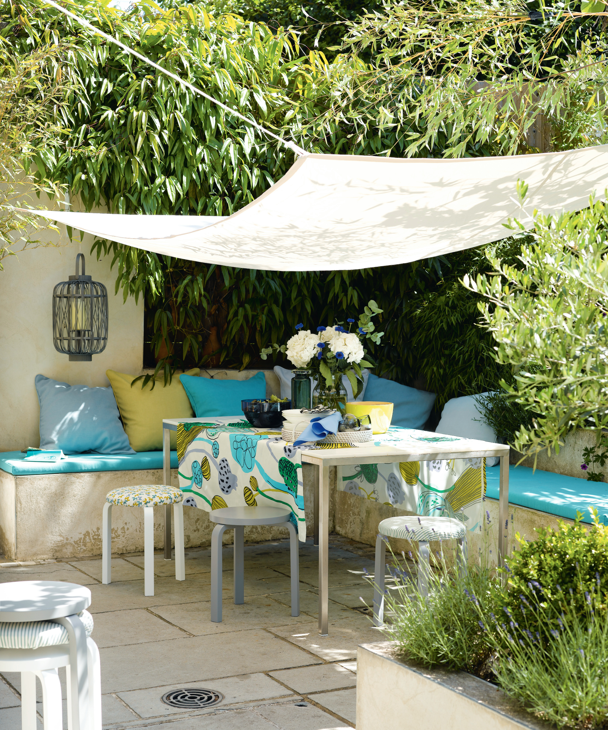 secluded shady corner with seating in a garden
