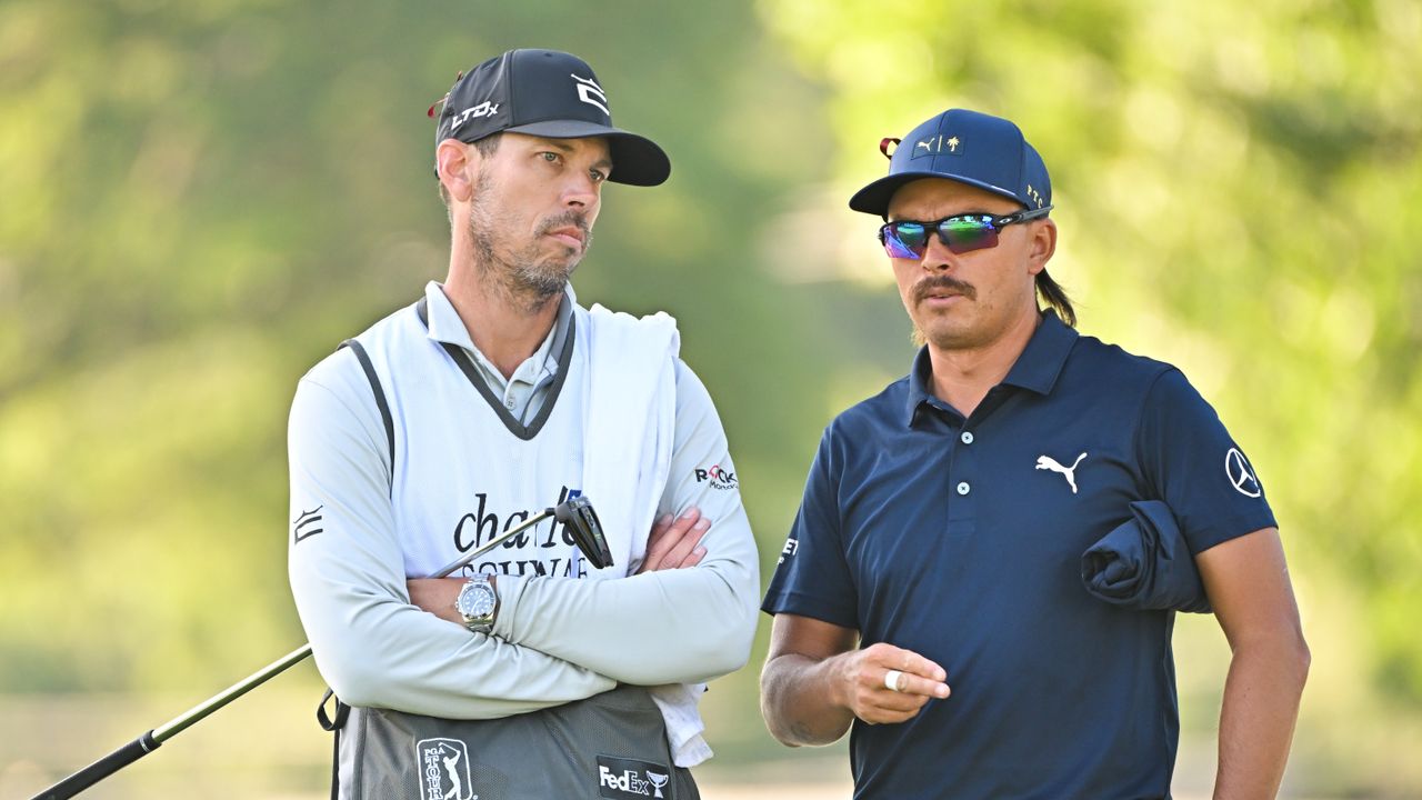 Rickie Fowler and caddie