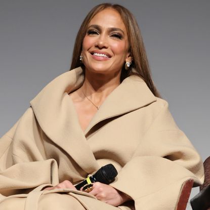 Jennifer Lopez shared a sneak peek at 'Kiss of the Spider Woman' with her in a rust orange blazer