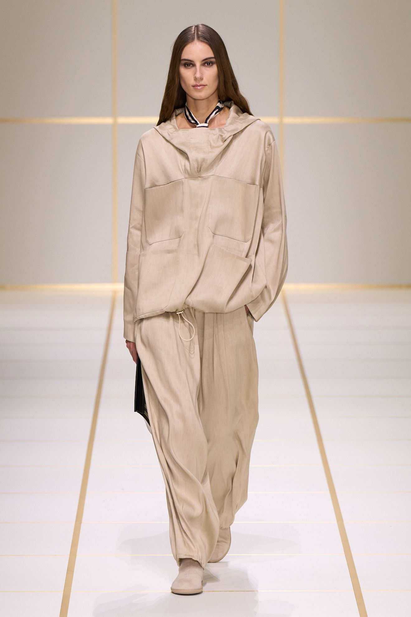 a model walks the giorgio armani s/s 27 runway.