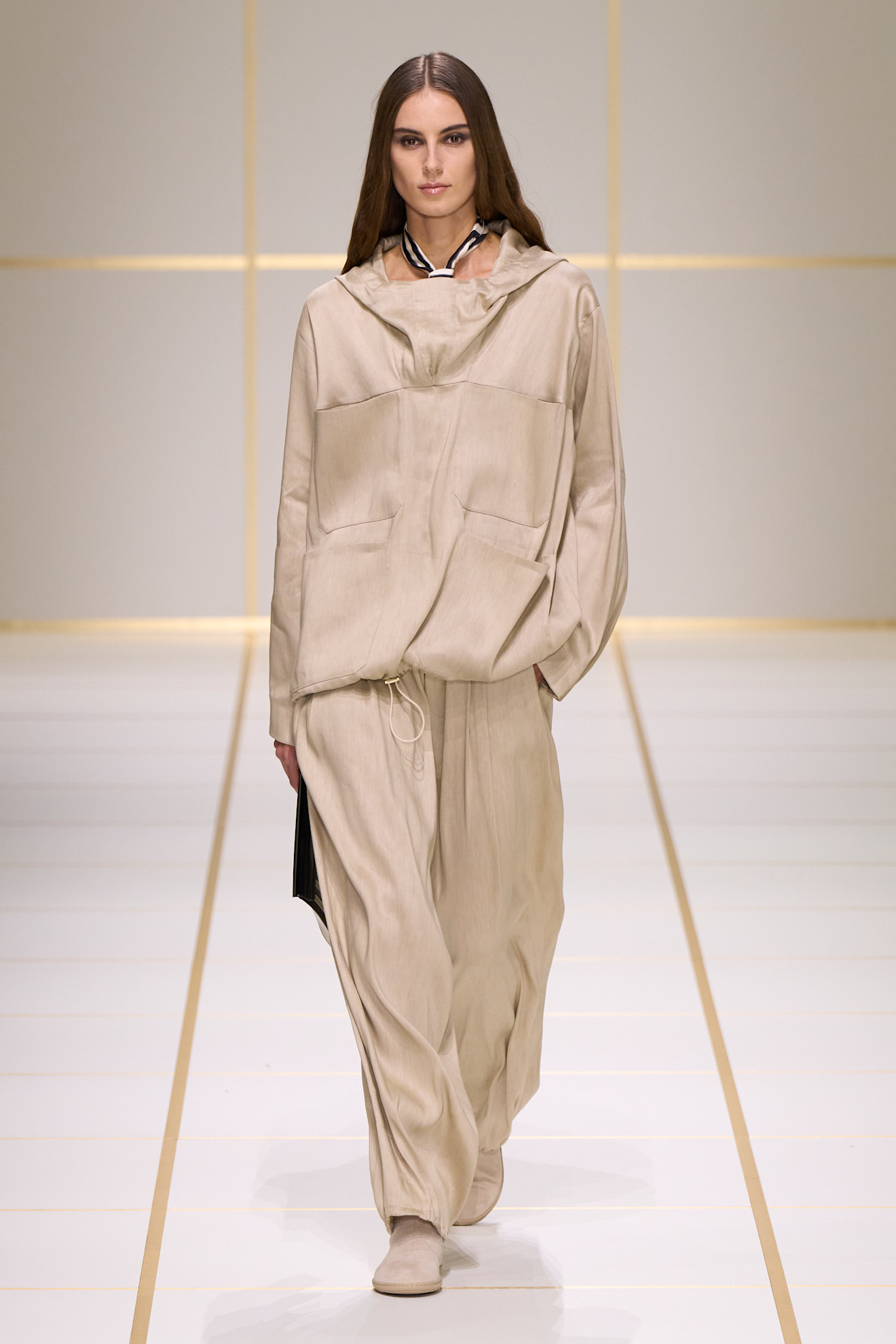 a model walks the giorgio armani s/s 27 runway.