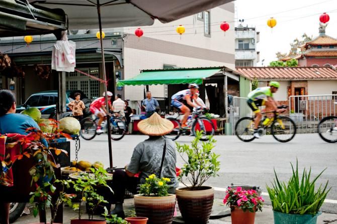 At the Taiwanese country side, a man watching the race in Tour de Taiwan 2012.