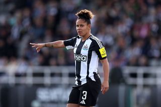 Demi Stokes pointing on the pitch for Newcastle