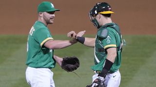 Liam Hendriks #16 and Sean Murphy #12, Oakland Athletics