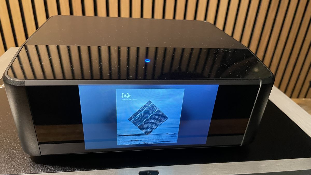 Bluesound Node Icon on a hi-fi rack in a listening room