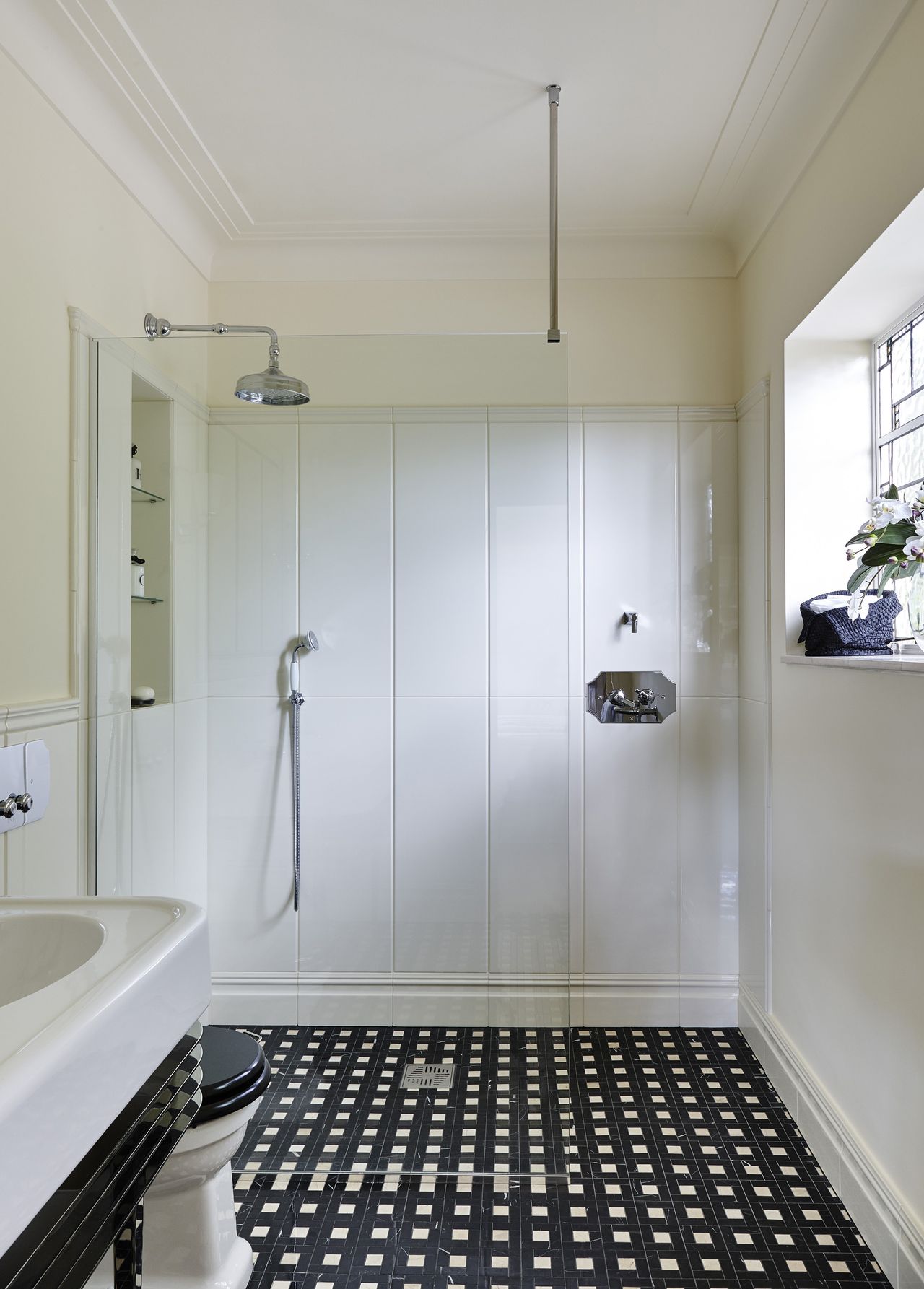 wetroom by Devon &amp; Devon with black and white floor