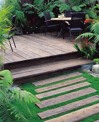 this garden decking idea uses a weathered effect decking to add character