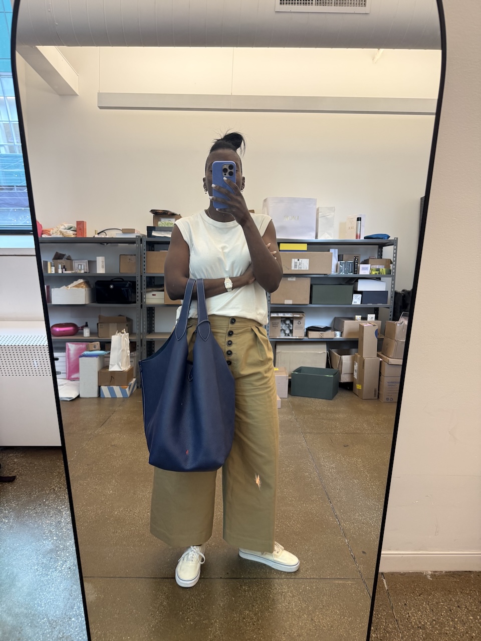 Nikki Ogunnaike carrying an oversized blue ralph lauren tote