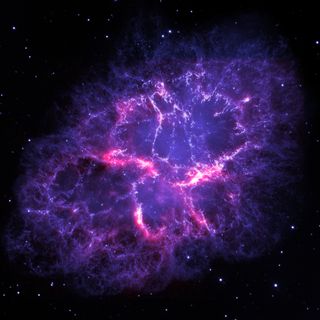 A composite view of the famous Crab Nebula, from the Herschel Space Observatory and the Hubble Space Telescope.