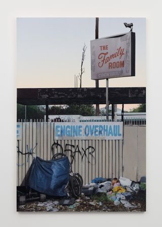 Sayre Gomez photograph in gallery, of dumped rubbish and rough sleeper