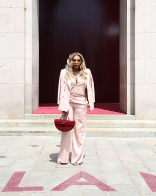 serena williams at the gucci show wearing a head to toe gucci pink outfit