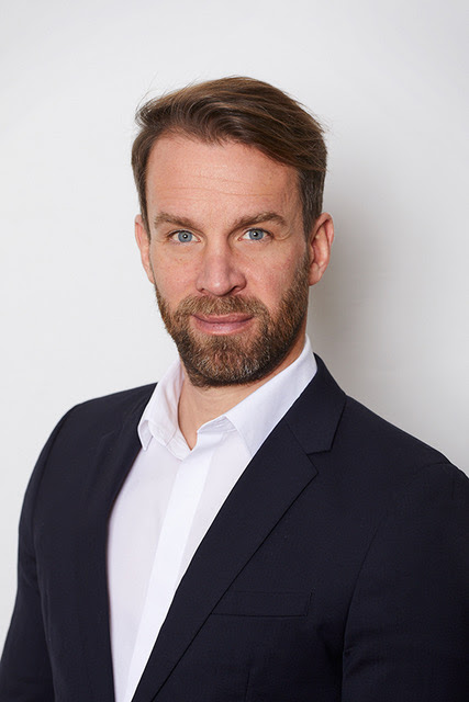 Headshot of Christoph Odenthal.