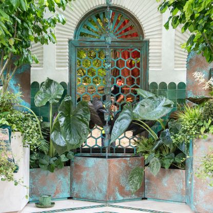 Copper basins with rain chain hanging into center one