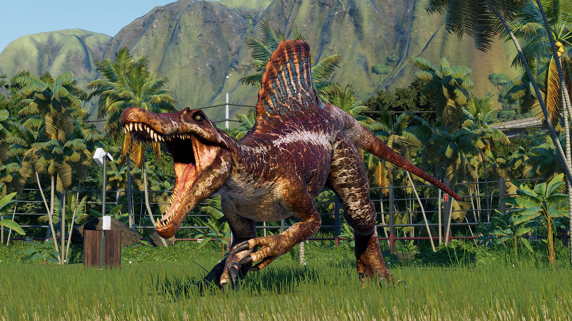 A close-up of a dinosaur roaring in an enclosure during one of the best Jurassic Park games, Jurassic World Evolution