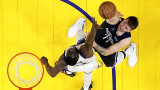 Luka Doncic #77 of the Dallas Mavericks shoots the ball against Draymond Green #23 of the Golden State Warriors during the second half during the fourth quarter in Game Two of the 2022 NBA Playoffs Western Conference Finals at Chase Center on May 20, 2022 in San Francisco, California.