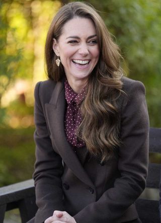 Kate Middleton wearing a brown coat